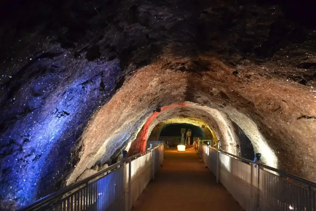 Lit tunnel through pink rock salt inside the Khewra Salt Mine, Pakistan
